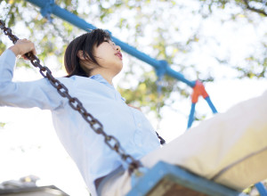 Teenage Girl on Swing --- Image by © Royalty-Free/Corbis